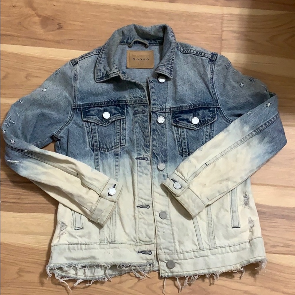 Distressed jean jacket with star embroidery